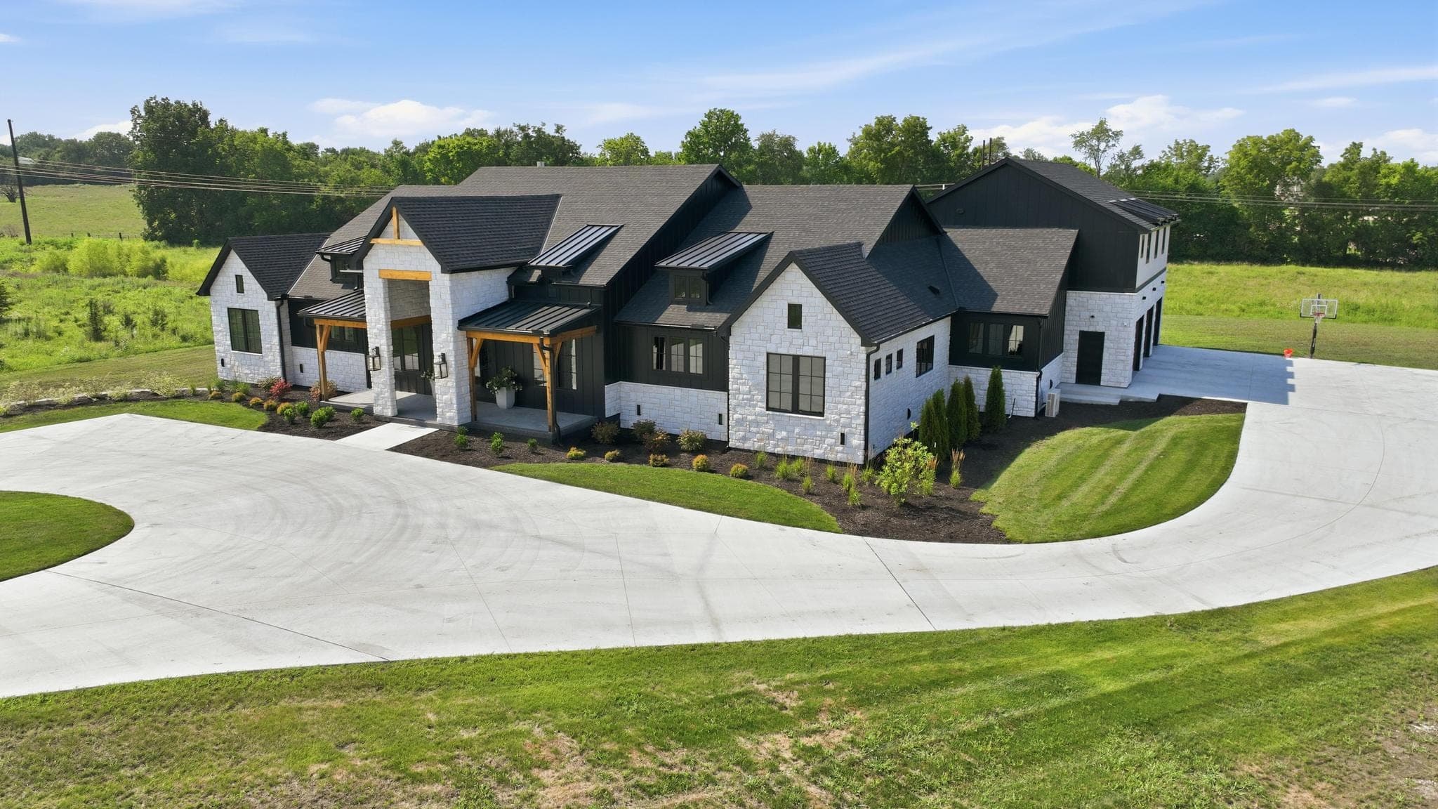 Low aerial of the front elevation and attached garages