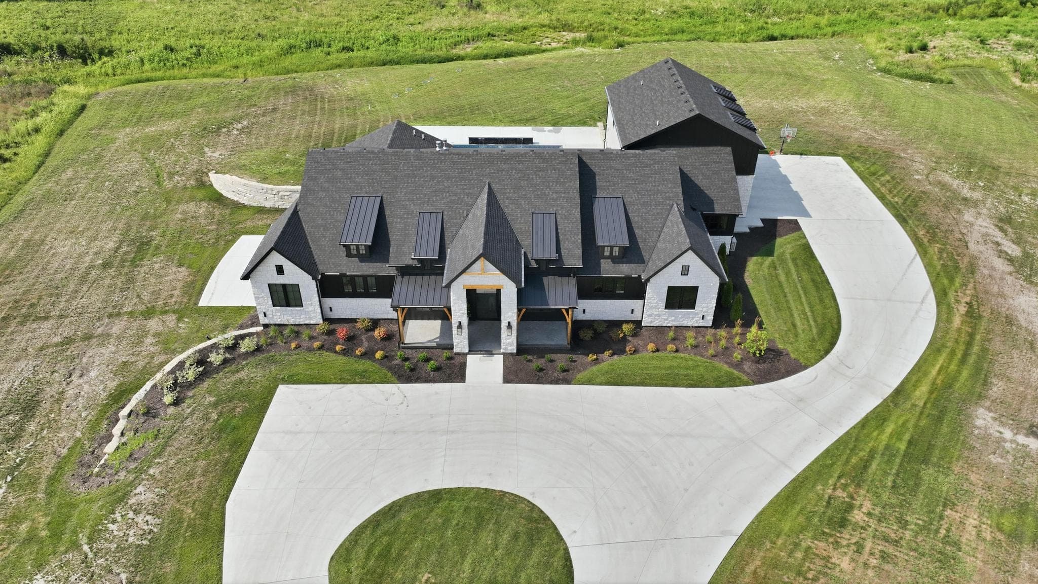 Overhead drone view of the front of the house and circular drive