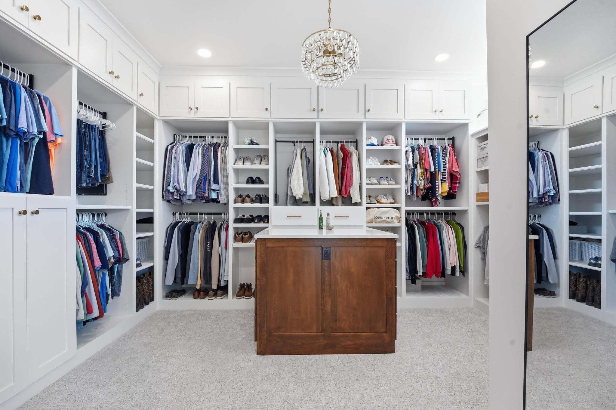 Primary closet island and hanging storage
