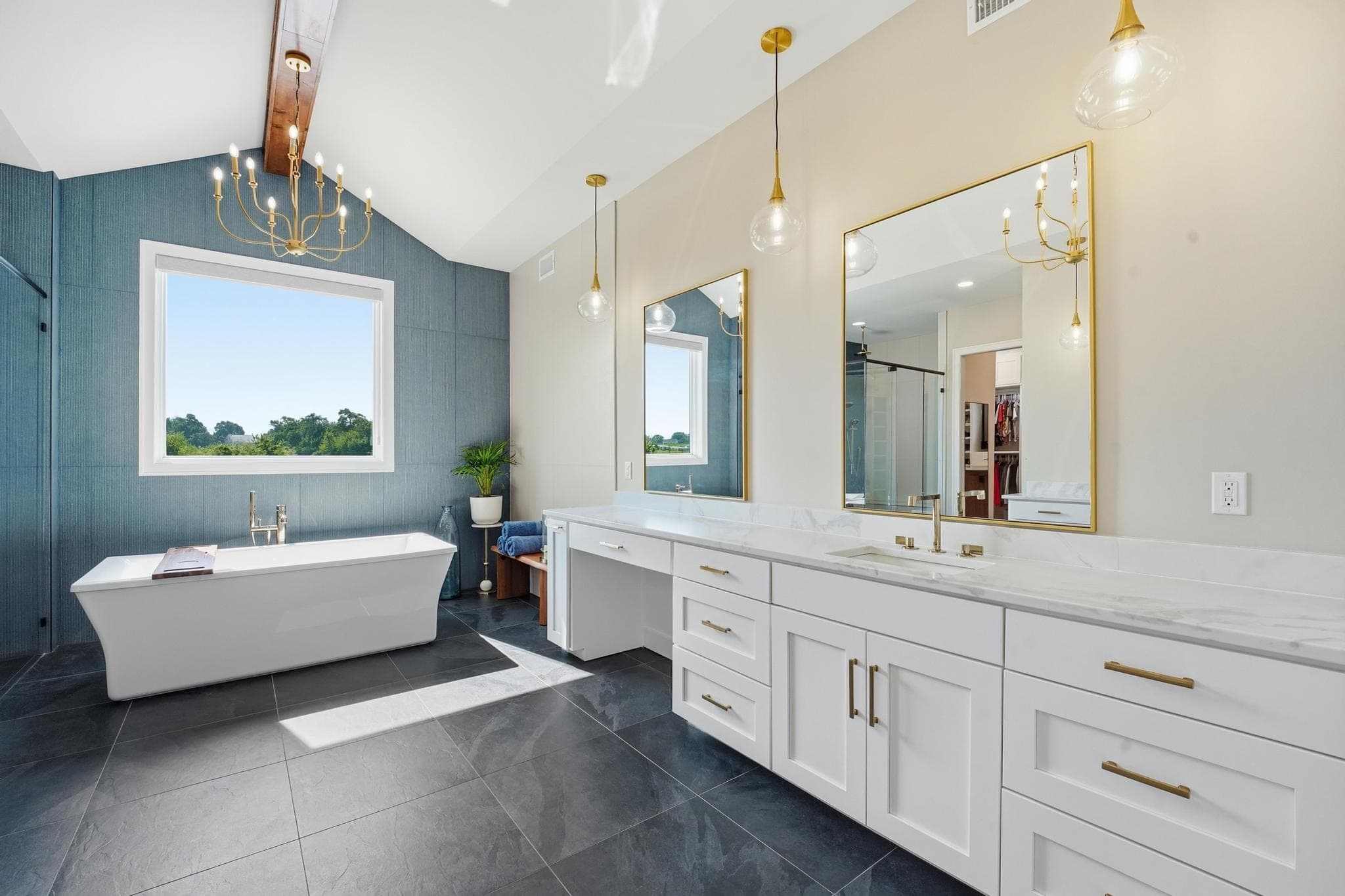 Freestanding soaking tub under a window