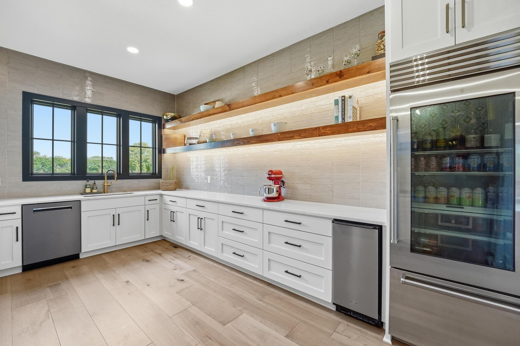 Prep kitchen with beverage refrigerator and second dishwasher