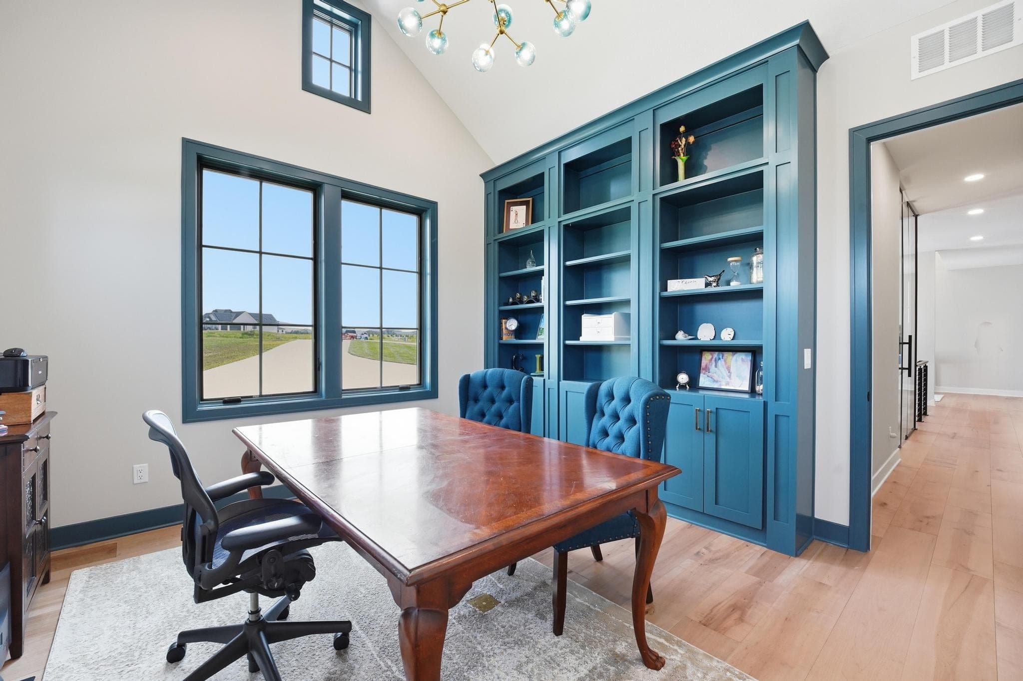 Office built-ins and desk with a view to the yard
