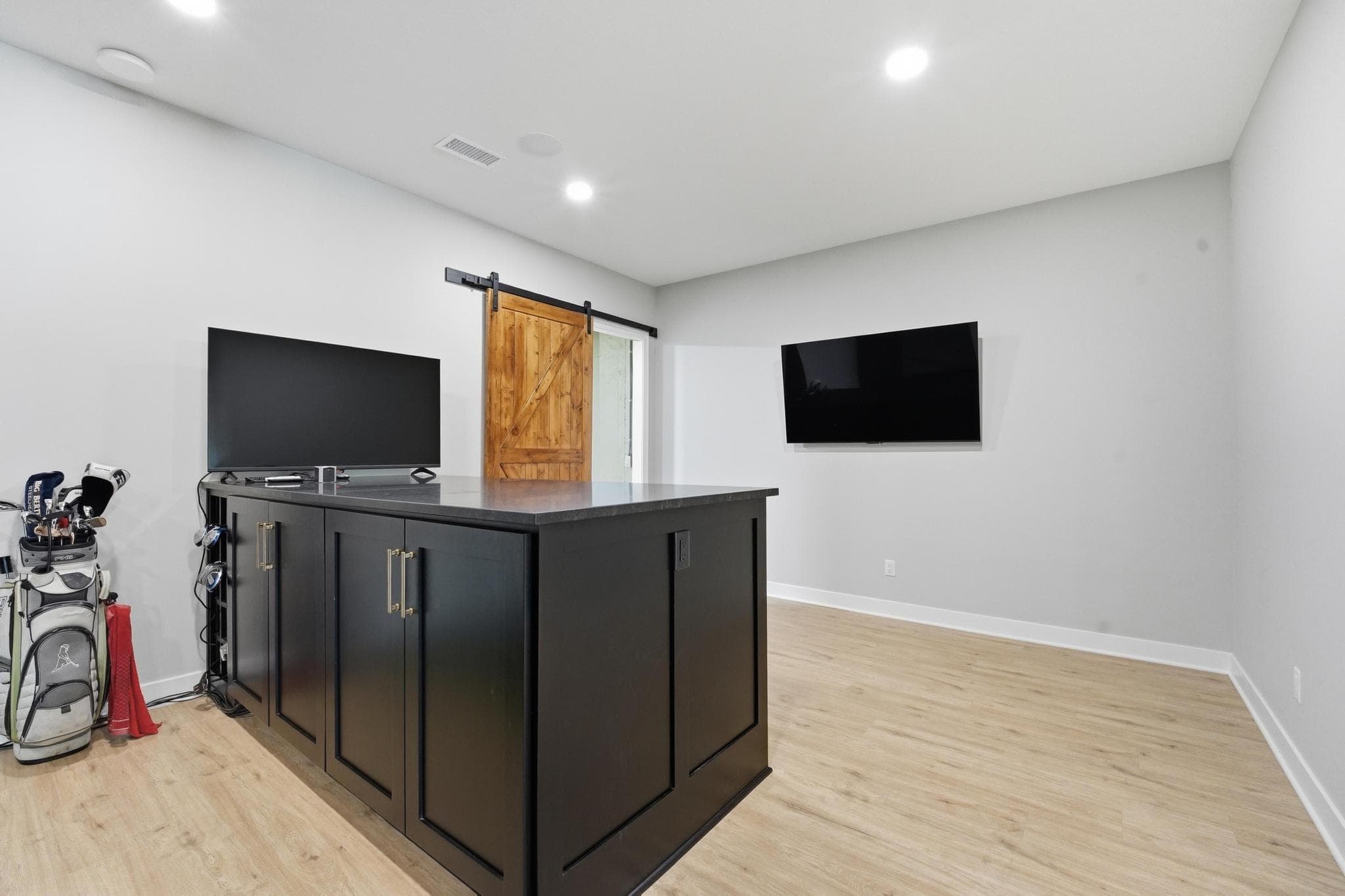 Lower level lounge with bar and TV