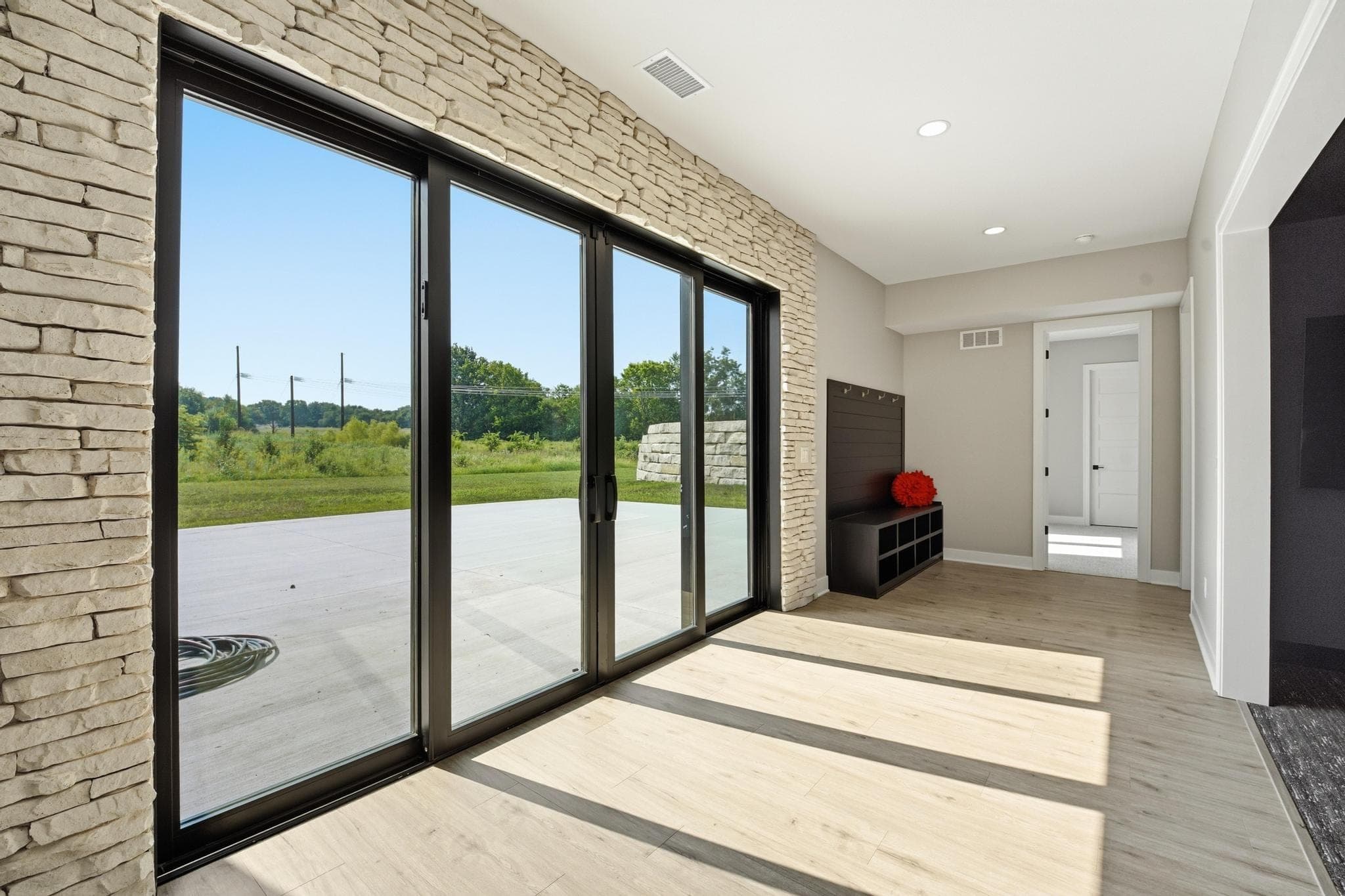 Lower level walkout with sliding glass doors to the patio