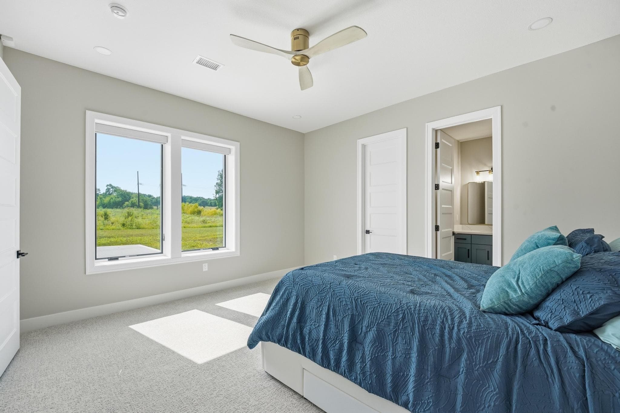 Lower level bedroom looking toward its ensuite
