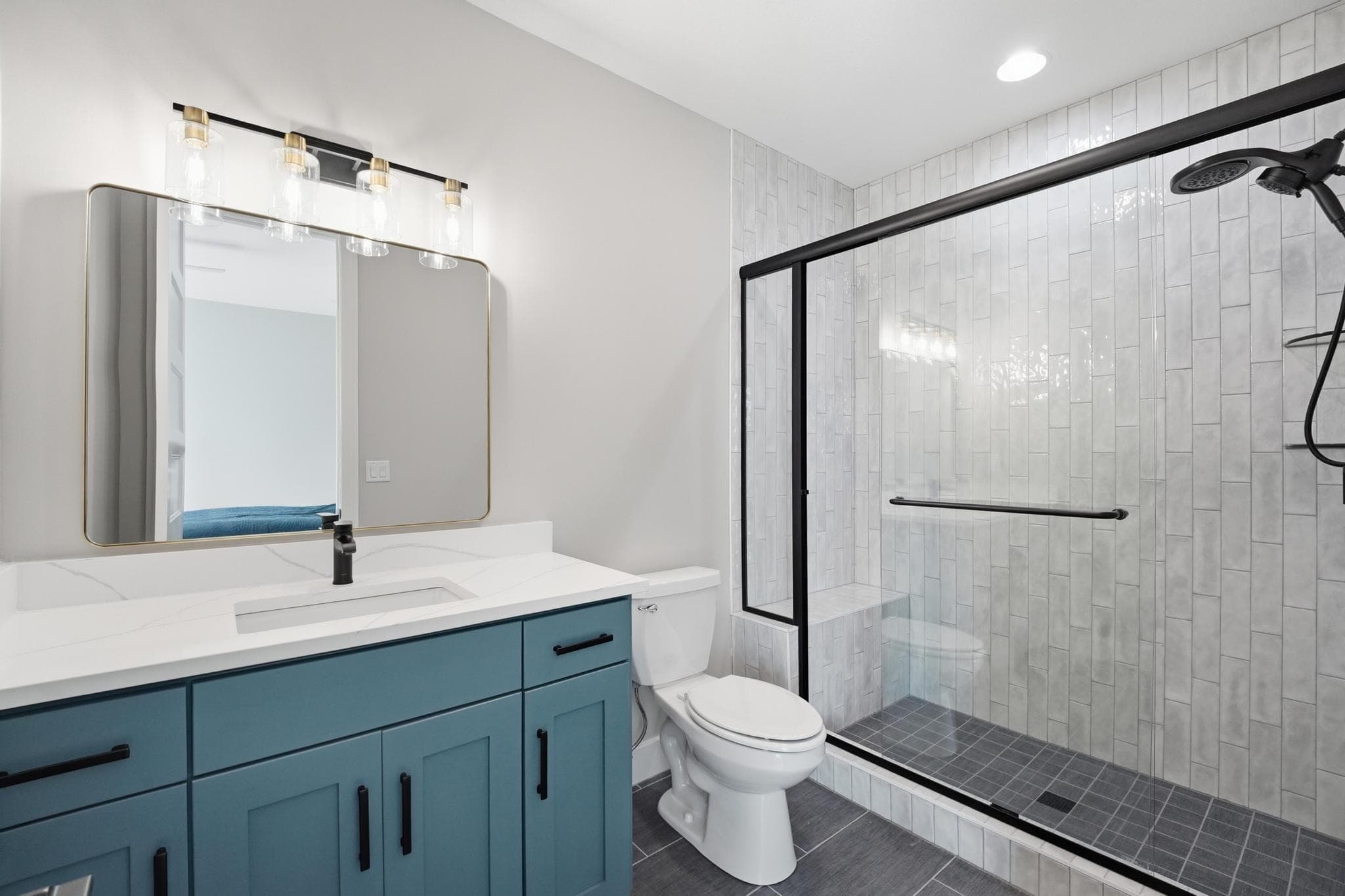 Lower level bath with a teal vanity