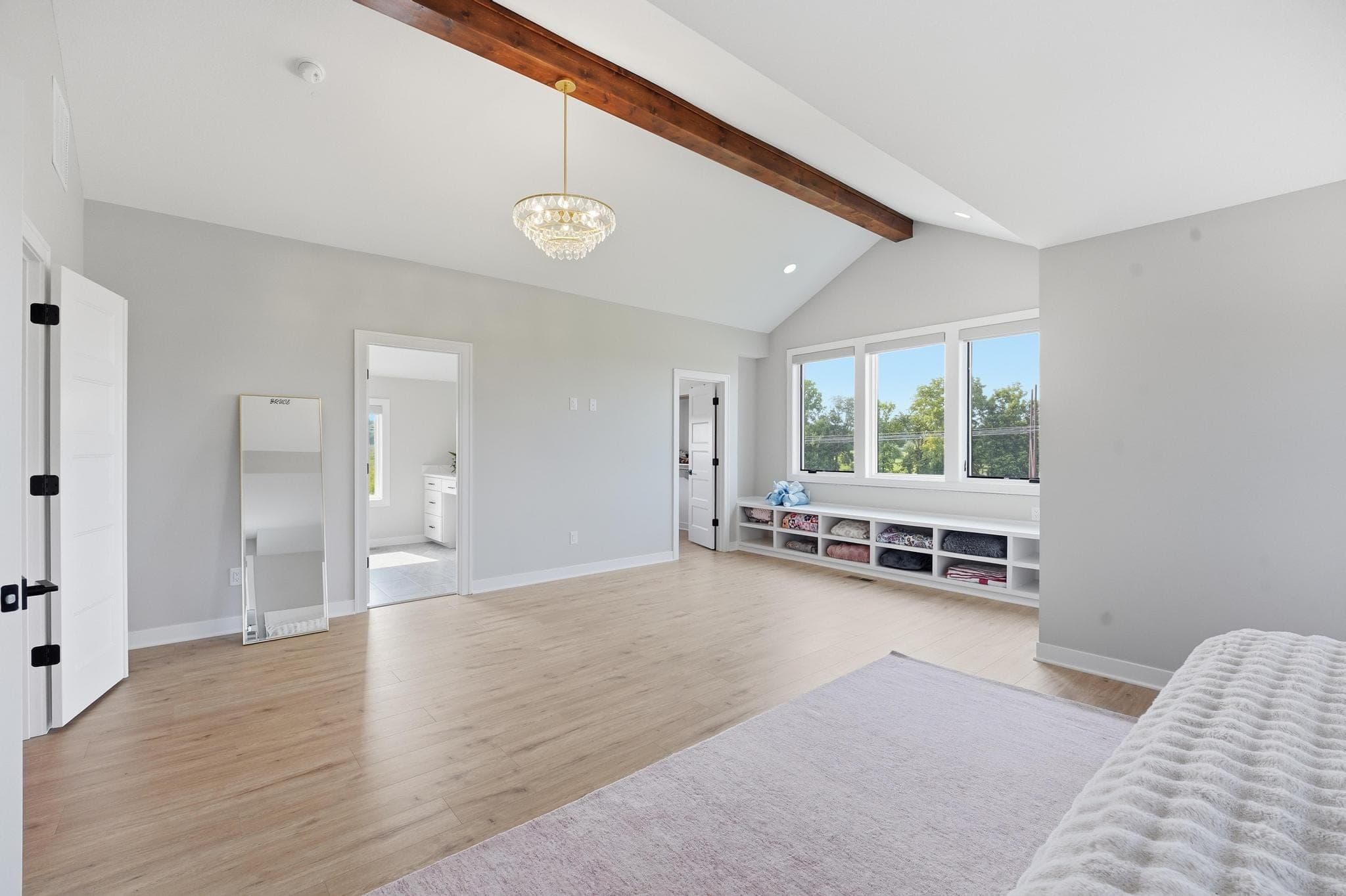 Upstairs bedroom under a vaulted ceiling