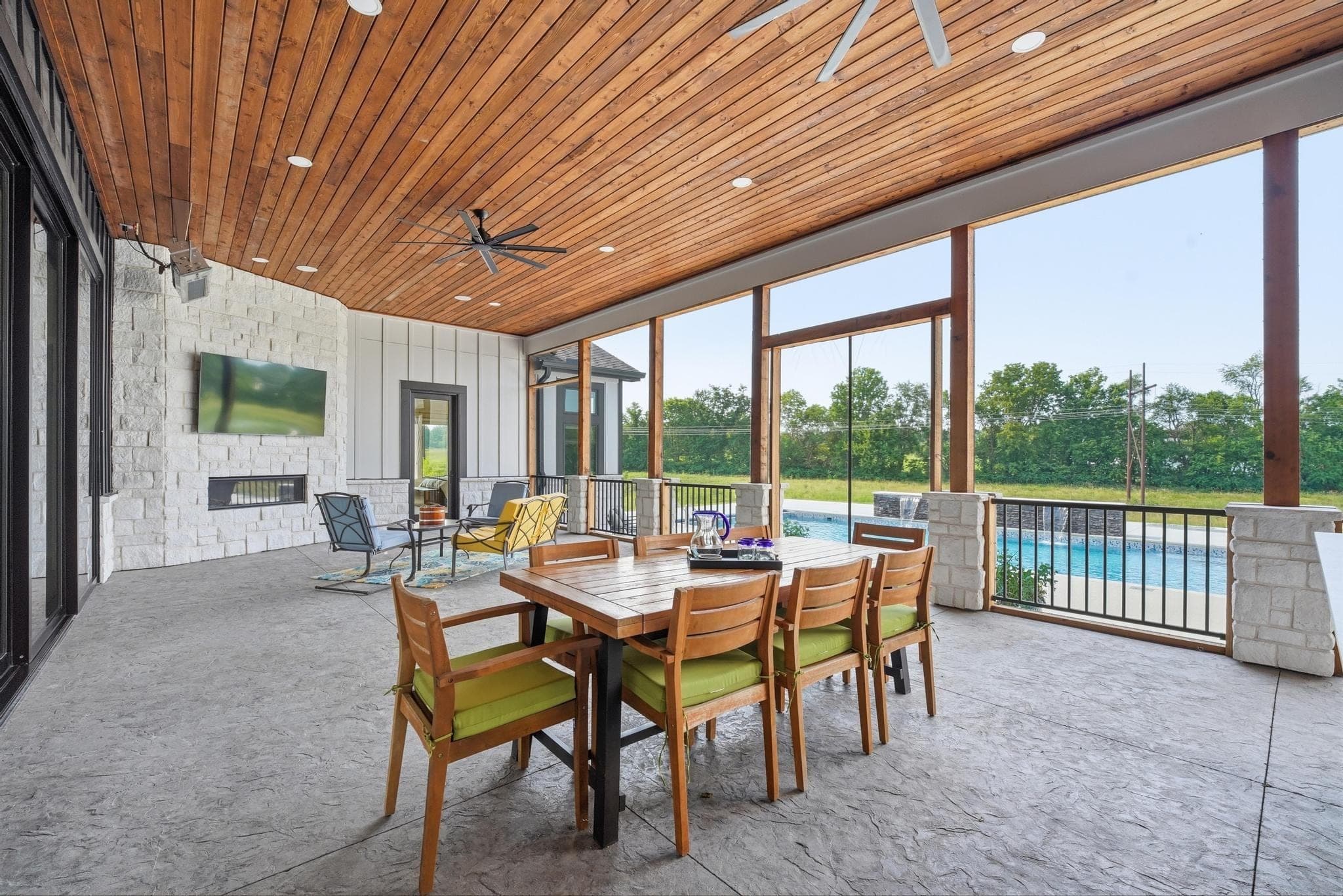 Covered patio dining under a wood ceiling