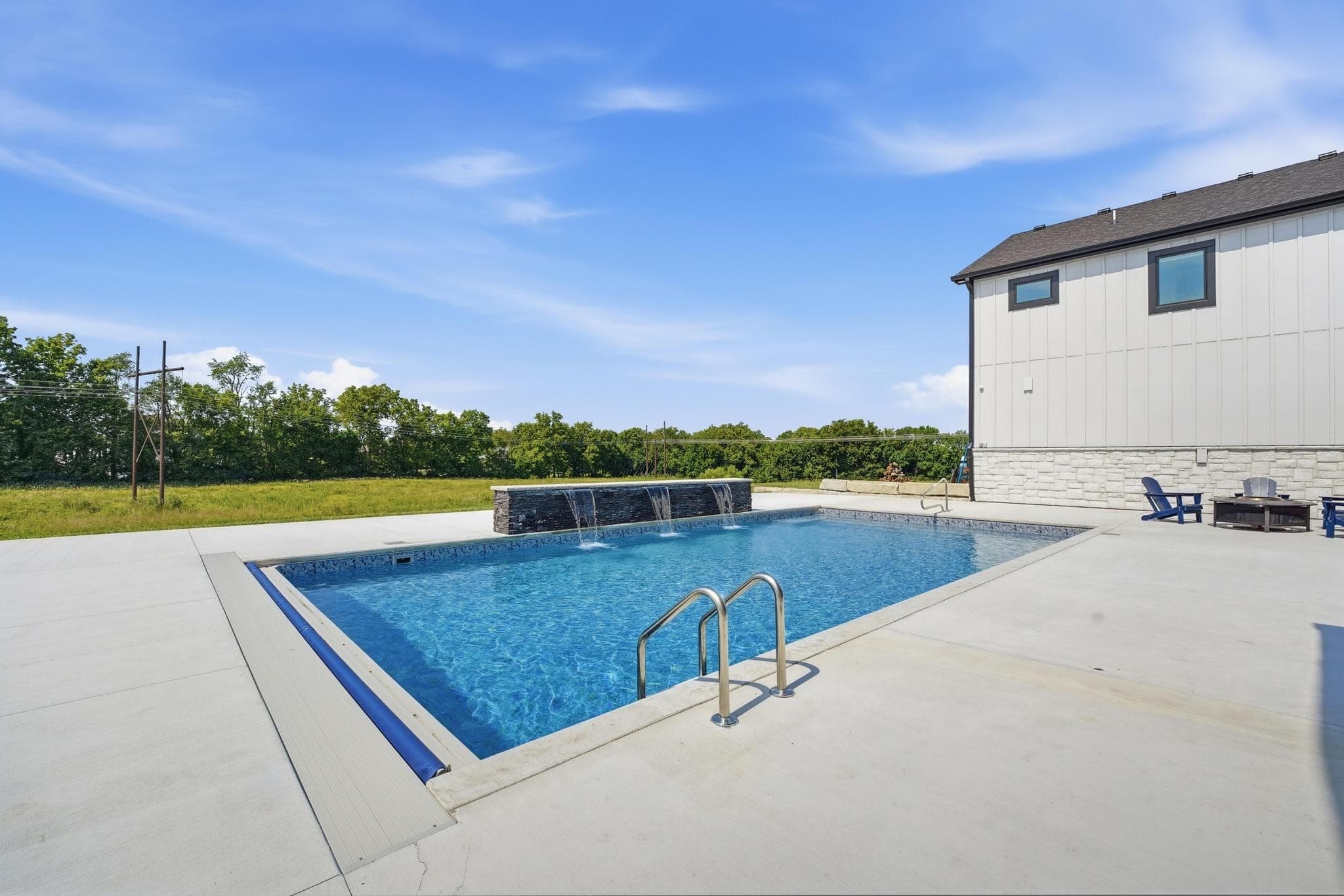 Pool with the rear of the house beyond