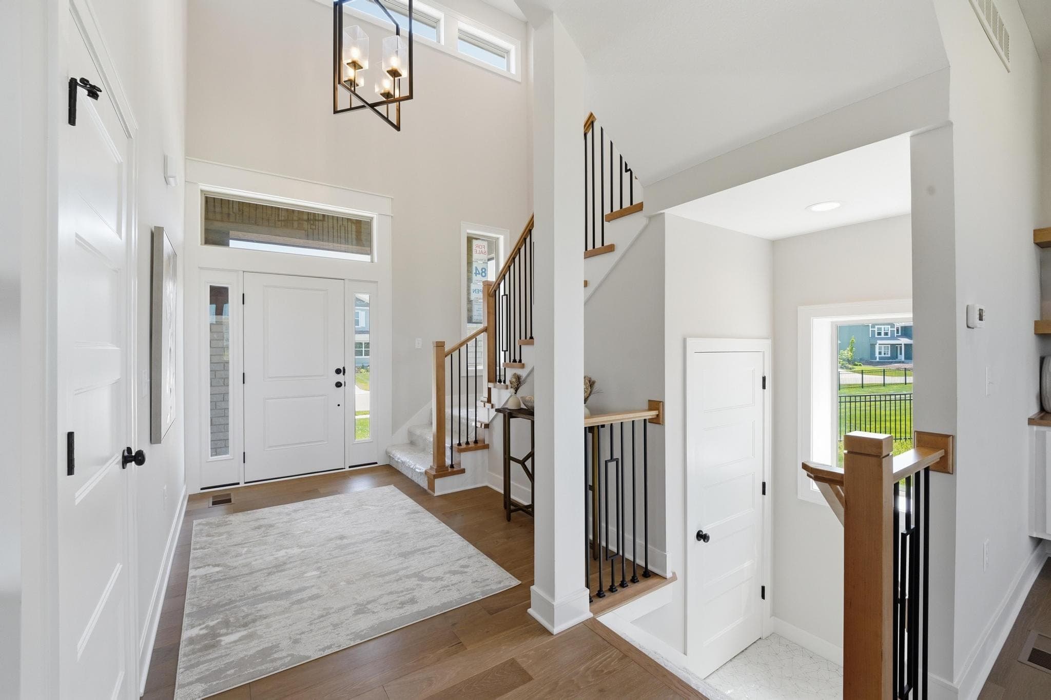 Entry with staircase and oak floors