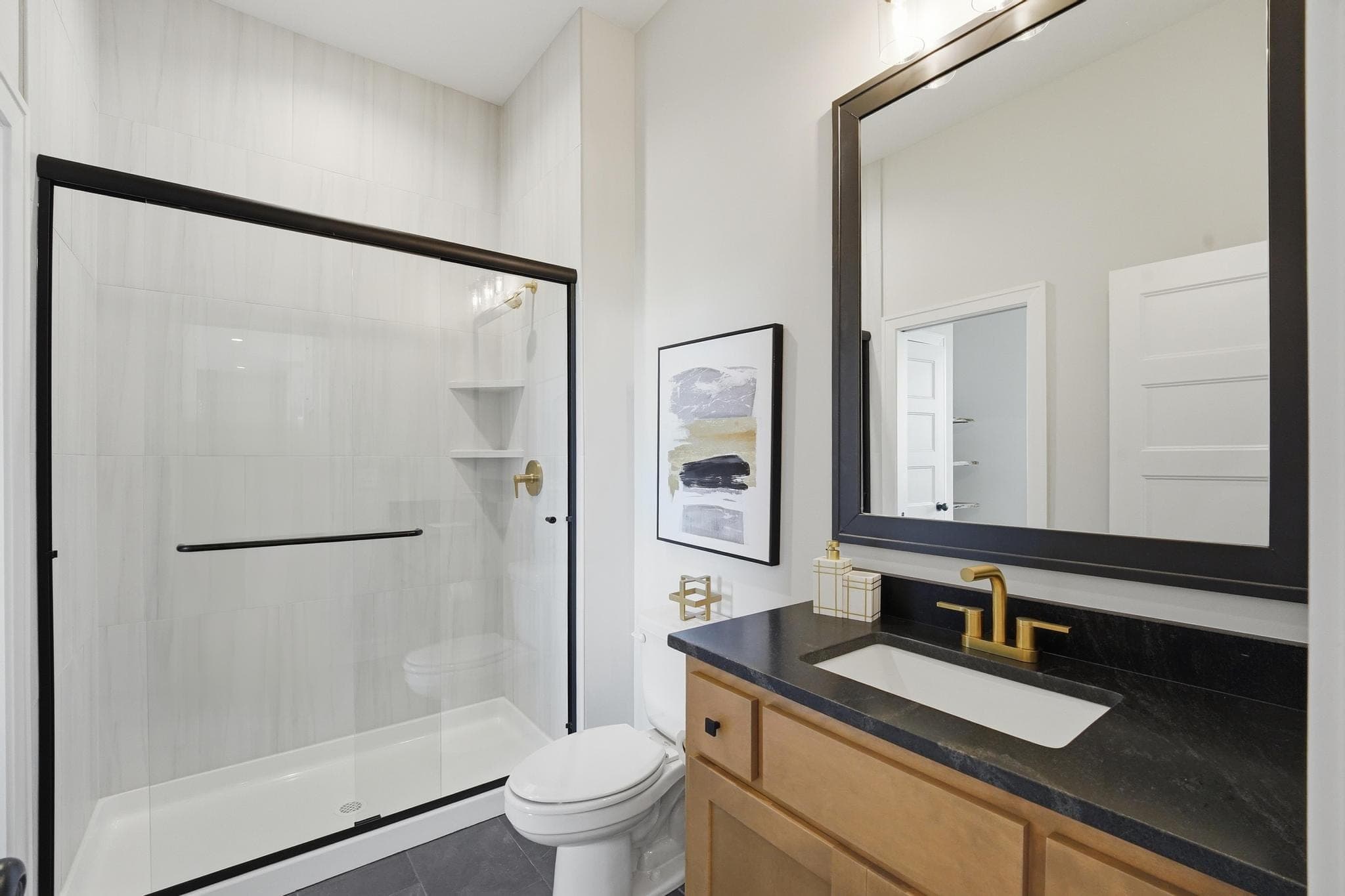 Powder bath with a dark vanity