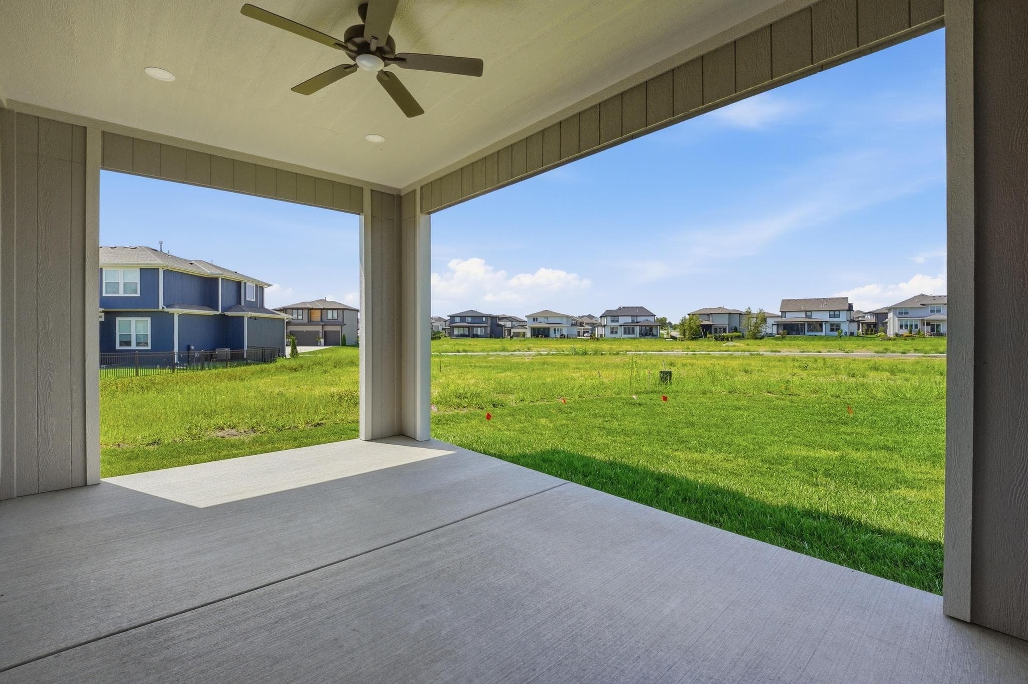 Covered rear patio overlooking the lot