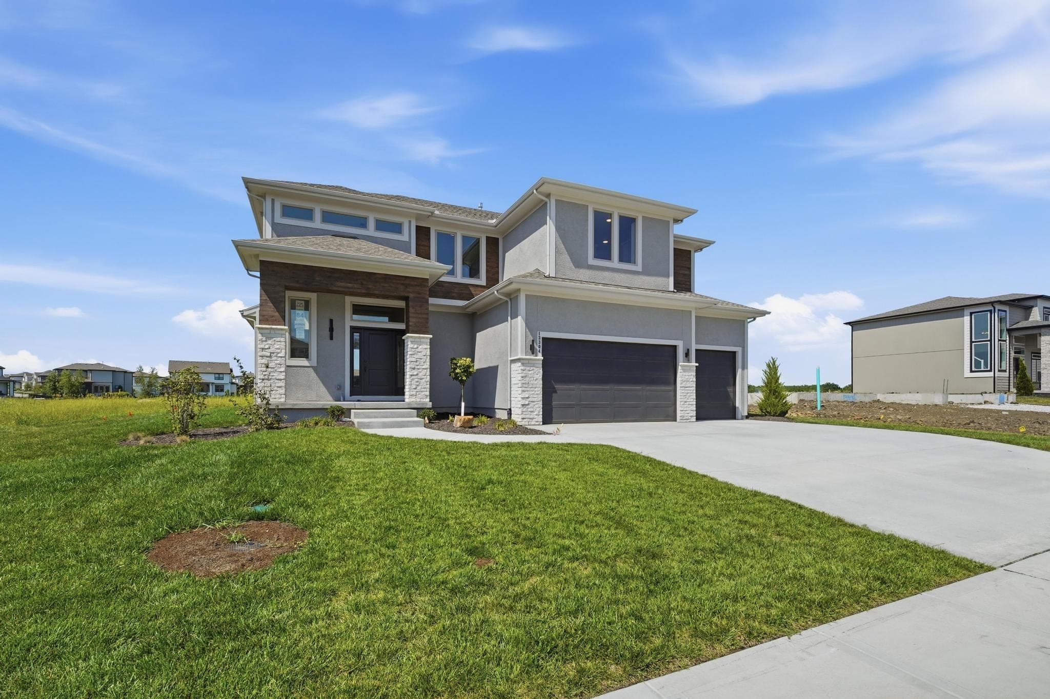 Wide front elevation with the neighborhood beyond